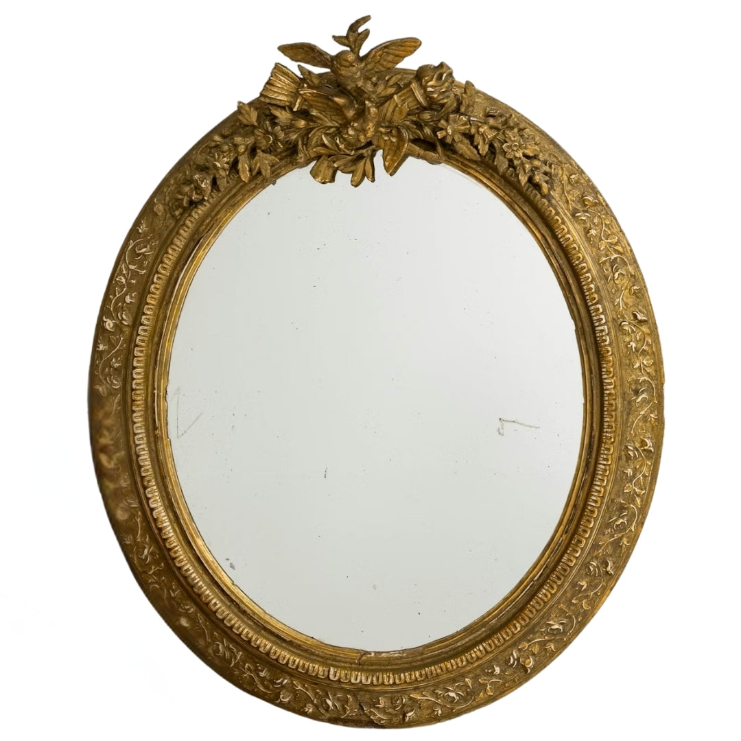 Miroir ovale français doré, sculpté d'un oiseau armorié, vers 1900
