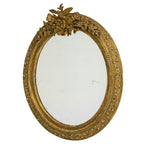 Miroir ovale français doré, sculpté d'un oiseau armorié, vers 1900
