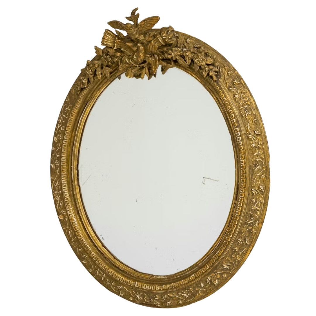Miroir ovale français doré, sculpté d'un oiseau armorié, vers 1900
